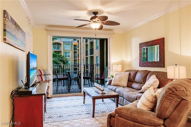 living room featuring ceiling fan and crown molding