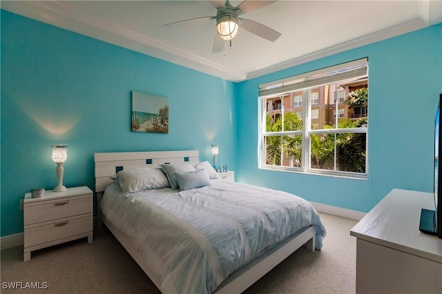 bedroom with carpet floors, ceiling fan, and ornamental molding