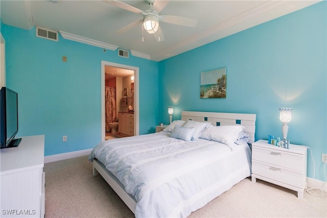 bedroom featuring carpet floors, ceiling fan, crown molding, and connected bathroom