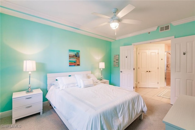 bedroom featuring ceiling fan, crown molding, and light colored carpet