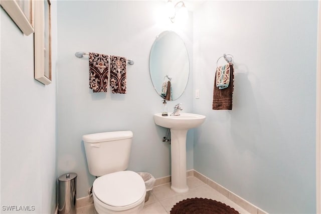 bathroom featuring tile patterned flooring and toilet