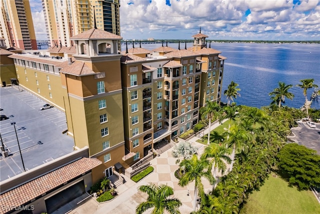 birds eye view of property with a water view