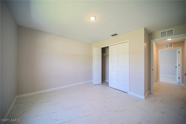 unfurnished bedroom with a closet