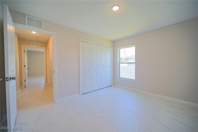 unfurnished bedroom with a closet