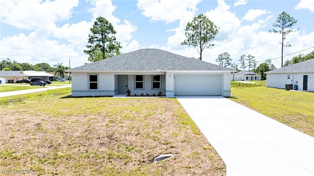 view of front of house with a garage and a front yard