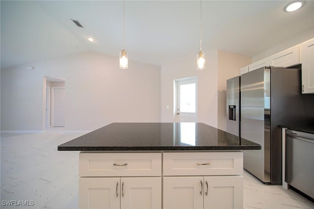 kitchen featuring white cabinetry, decorative light fixtures, stainless steel appliances, and a center island