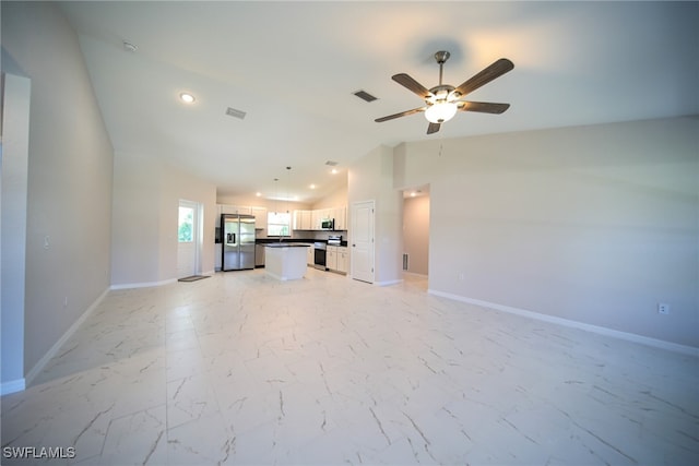 unfurnished living room with ceiling fan, light tile patterned floors, and lofted ceiling