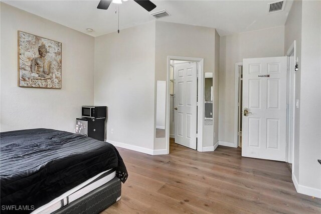 bedroom featuring hardwood / wood-style floors and ceiling fan