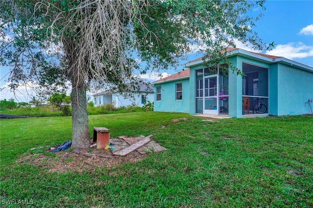 view of yard featuring a sunroom