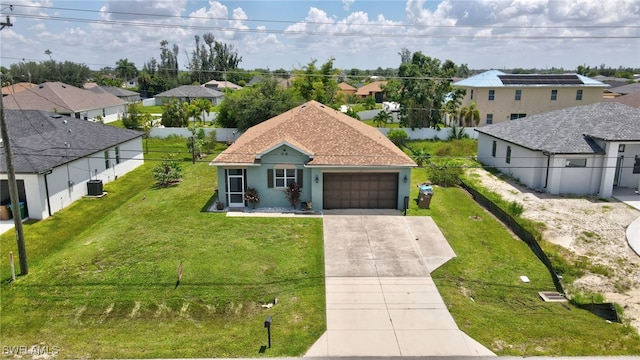 view of front facade with a front lawn and a garage