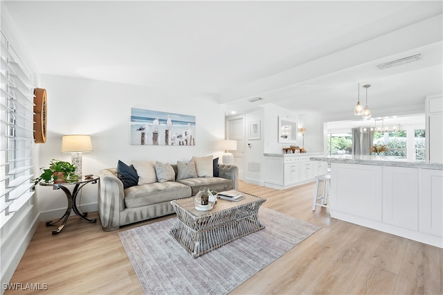 living room with light hardwood / wood-style floors