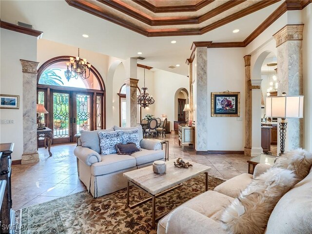 living room with a high ceiling, a notable chandelier, a raised ceiling, crown molding, and french doors