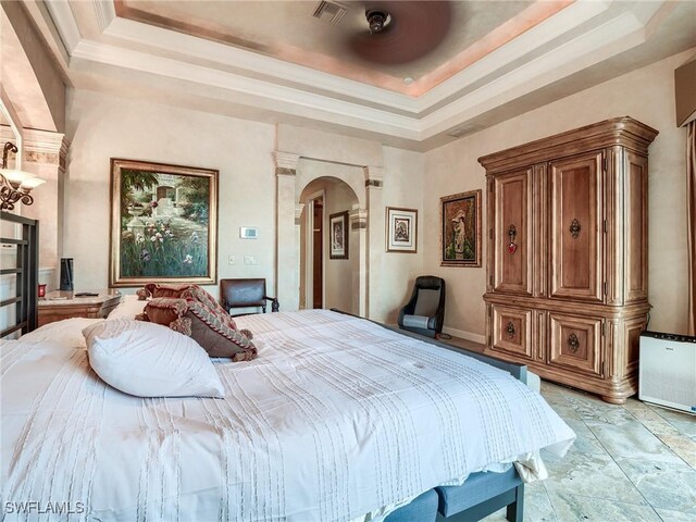 bedroom with a tray ceiling