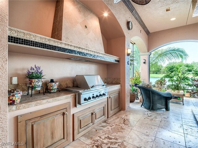 view of patio featuring grilling area and exterior kitchen