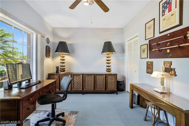 home office with ceiling fan and light colored carpet