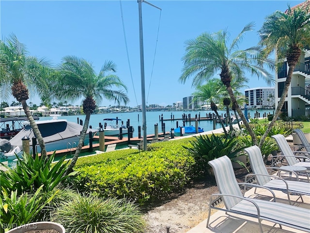 222 Harbour Dr Unit 114, Naples, FL 34103 - view of patio featuring a boat dock and a water view