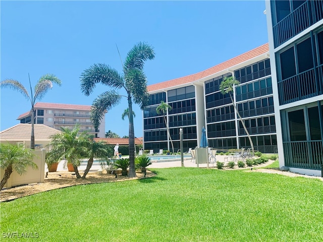 222 Harbour Dr Unit 114, Naples, FL 34103 - view of property featuring a pool