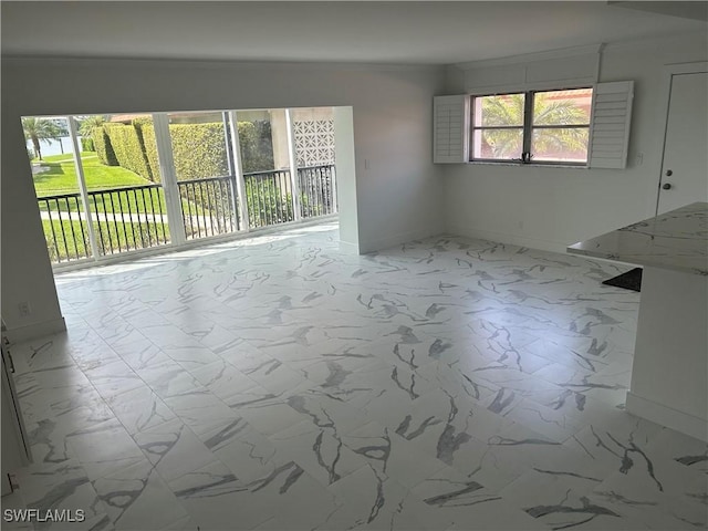 222 Harbour Dr Unit 114, Naples, FL 34103 - unfurnished room featuring crown molding and marble look tiles