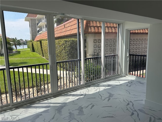 222 Harbour Dr Unit 114, Naples, FL 34103 - view of gate with a water view and a yard