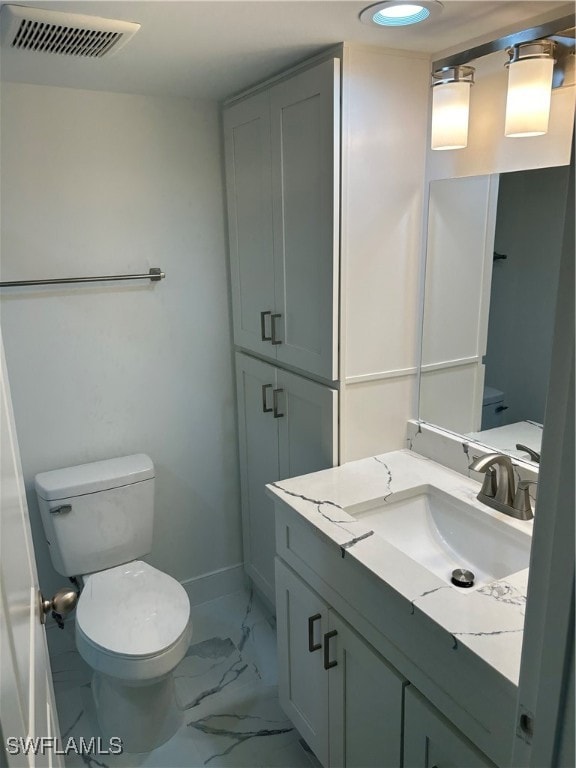 222 Harbour Dr Unit 114, Naples, FL 34103 - bathroom with vanity and toilet