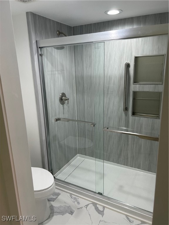 222 Harbour Dr Unit 114, Naples, FL 34103 - bathroom with toilet and a shower with shower door
