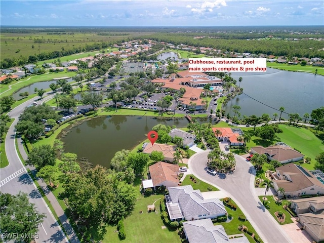 birds eye view of property featuring a water view and a residential view