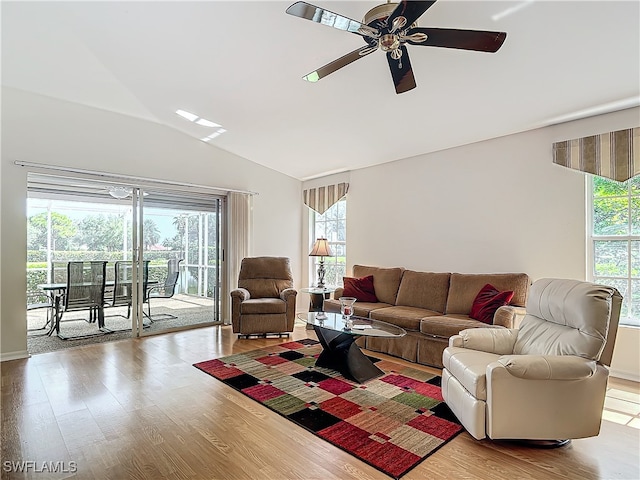 living room with light wood-type flooring, lofted ceiling, and ceiling fan