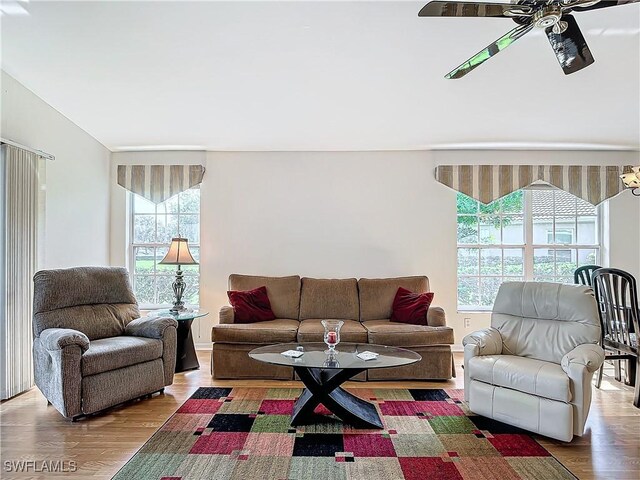 living room with hardwood / wood-style floors, ceiling fan, and a wealth of natural light