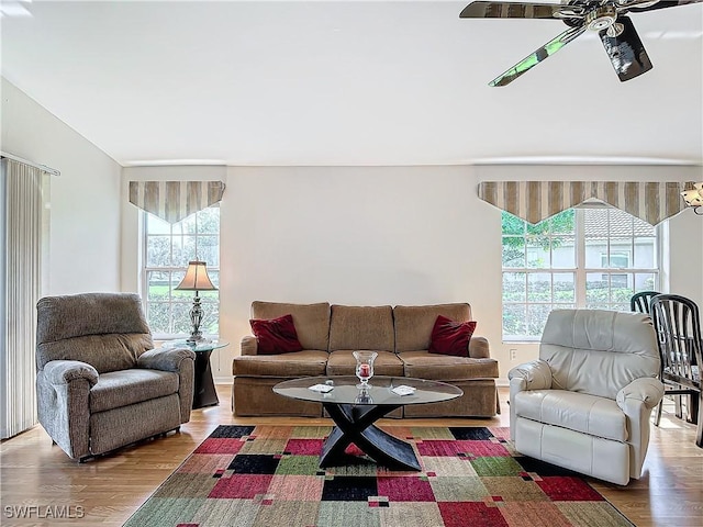 living room featuring wood finished floors and a ceiling fan