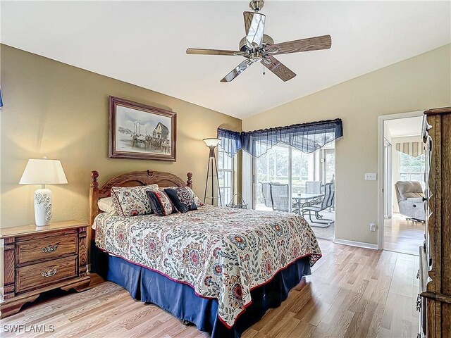 bedroom featuring access to exterior, vaulted ceiling, ceiling fan, and light hardwood / wood-style floors