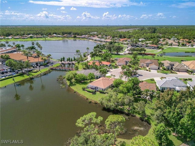 birds eye view of property featuring a water view and a residential view