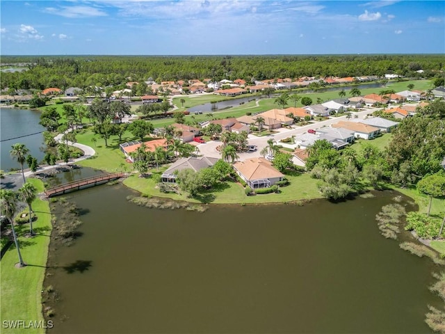 bird's eye view with a residential view and a water view