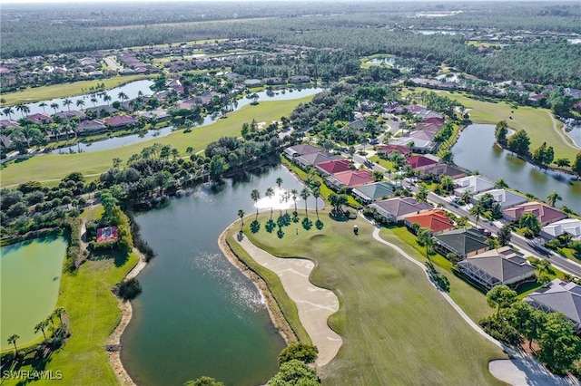 birds eye view of property featuring view of golf course, a water view, and a residential view