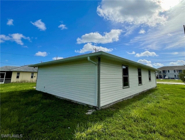 view of home's exterior with a lawn