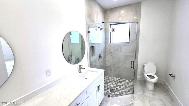 bathroom featuring an enclosed shower, vanity, and toilet