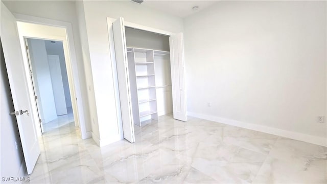 unfurnished bedroom with a closet