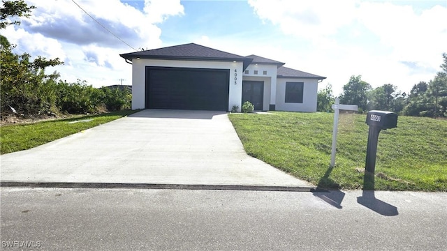 view of front facade with a front lawn and a garage