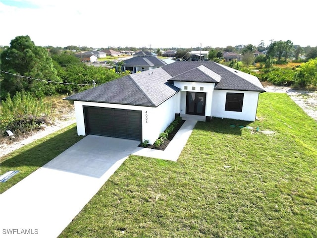 modern inspired farmhouse with a garage and a front yard