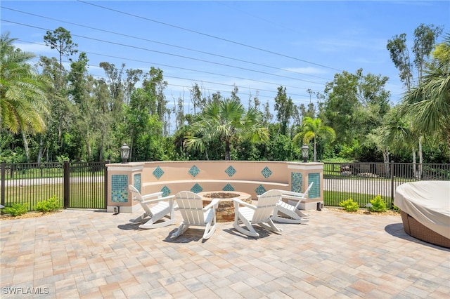 view of patio / terrace with an outdoor fire pit