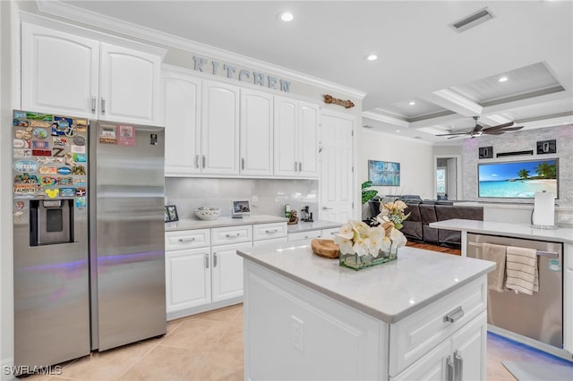 kitchen with ceiling fan, coffered ceiling, ornamental molding, beam ceiling, and appliances with stainless steel finishes