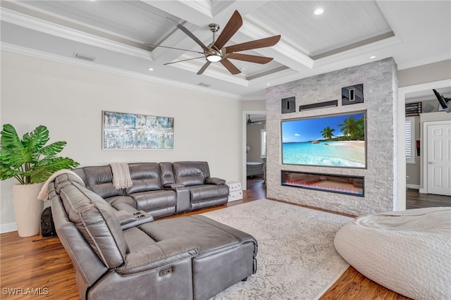 living room with ceiling fan, ornamental molding, hardwood / wood-style flooring, and coffered ceiling