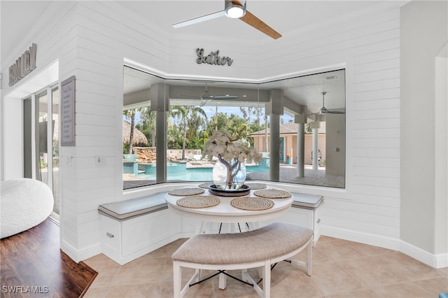 dining space featuring ceiling fan and light wood-type flooring