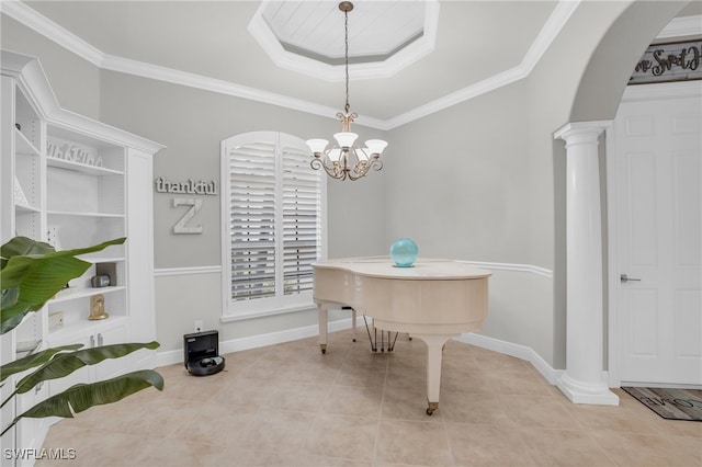 tiled office featuring a tray ceiling, crown molding, an inviting chandelier, and decorative columns