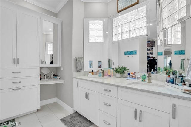 bathroom featuring tile patterned floors, vanity, and ornamental molding