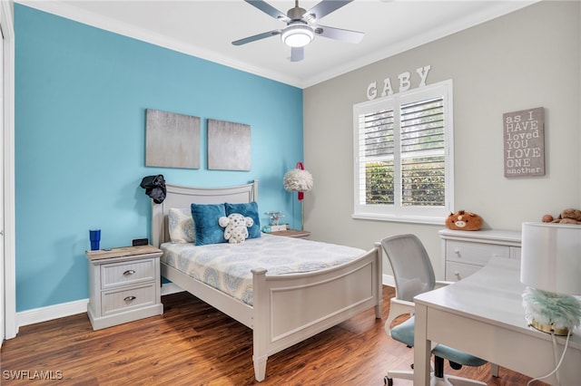 bedroom with hardwood / wood-style flooring, crown molding, and ceiling fan