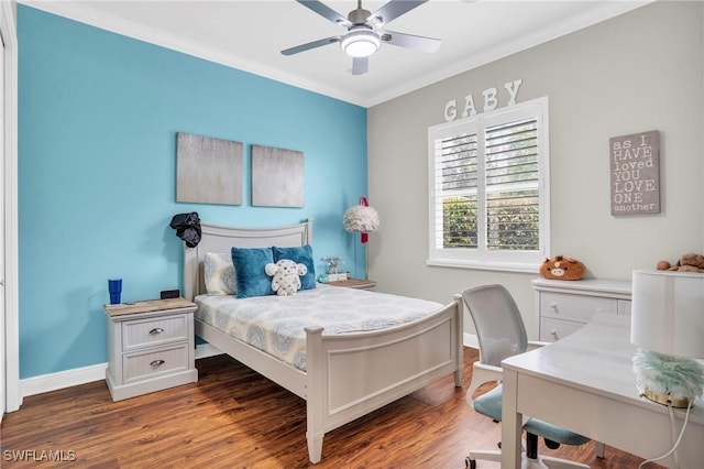 bedroom with ornamental molding, dark wood finished floors, a ceiling fan, and baseboards