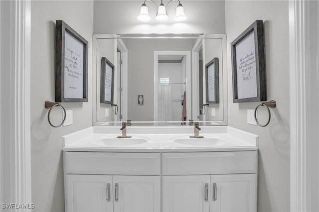 full bath featuring a sink and double vanity