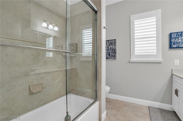 full bath with baseboards, toilet, enclosed tub / shower combo, tile patterned floors, and vanity