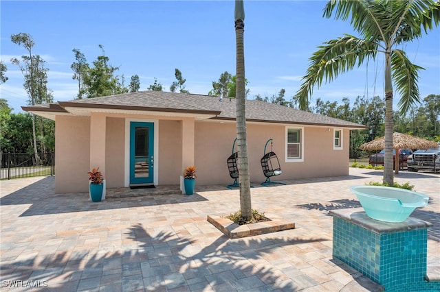 back of house with a patio area