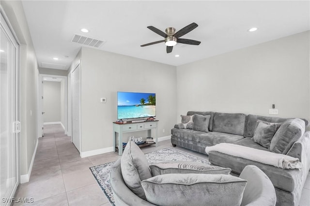 living area with light tile patterned floors, baseboards, visible vents, and recessed lighting